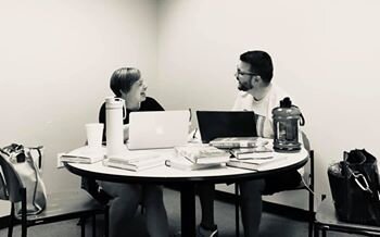 Julie and Jed writing. Julie says “Yes, we’re writing. Really.”